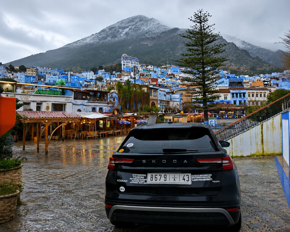 Comfort SUV parked in Chefchaouen with the Rif Mountains in the background